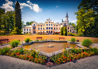 Attractive summer view of Vraz Castle with fountain and flower bed. Wonderful morning cityscape of Vraz village, South Bohemian Region, Czech Republic, Europe. Traveling concept background. © Andrew Mayovskyy