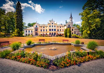 Attractive summer view of Vraz Castle with fountain and flower bed. Wonderful morning cityscape of Vraz village, South Bohemian Region, Czech Republic, Europe. Traveling concept background. © Andrew Mayovskyy