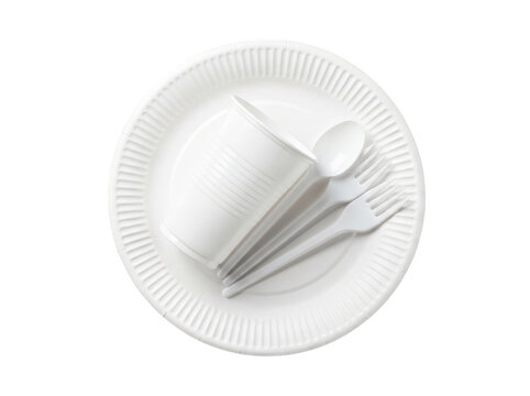 Disposable white plastic tableware including a plate, cup, spoon, and forks isolated on transparent background