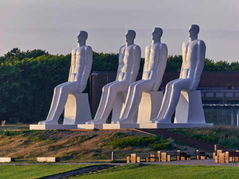 Mennesket ved Havet artwork giant white sculptures of men looking at the sea in Esbjerg Denmark This iconic landmark human connection to nature and the ocean