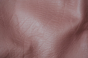 Fototapeta premium Abstract detailed close up of crumpled textured reddish brown synthetic leather fabric material background