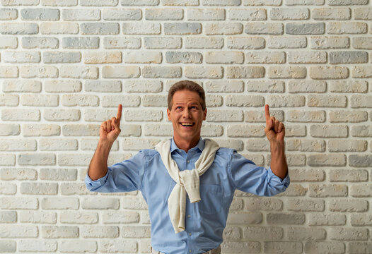 Man Pointing Upward Excitedly.