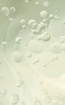 Abstract Green water bubbles essential oil beauty collagen Serum Repair cell background.