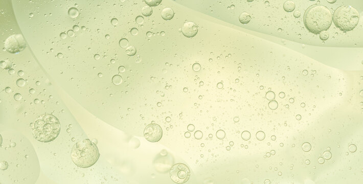 Abstract Green water bubbles essential oil beauty collagen Serum Repair cell background.
