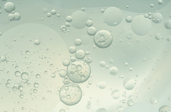 Abstract Green water bubbles essential oil beauty collagen Serum Repair cell background.