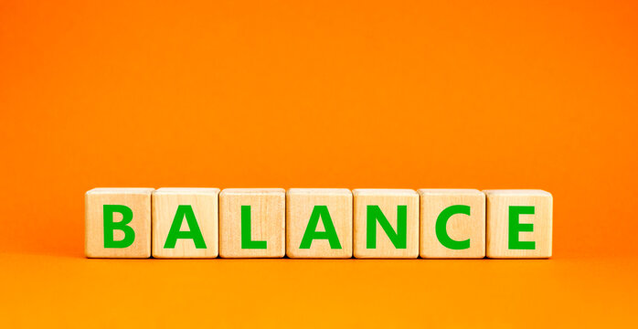 Balance word symbol. Concept word Balance on beautiful wooden blocks. Beautiful orange table orange background. Business medical balance word concept. Copy space.