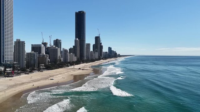 Aerial drone view over Surfers Paradise beach, esplanade and apartment towers, Gold Coast, Queensland Australia