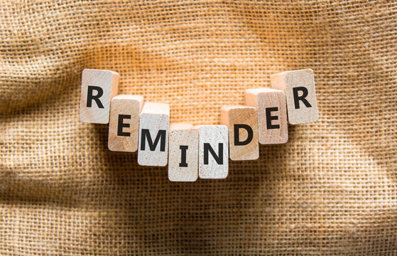Reminder word symbol. Concept word Reminder on beautiful wooden blocks. Beautiful canvas background. Business support help reminder word concept. Copy space.