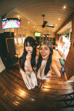 Portrait of Gen Z asian young woman wide angle aesthetic Y2K bohemian fashion travel in Bangkok