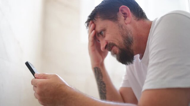 Man relaxing on toilet and staring at smartphone with a suggestive expression, illustrating private moments, digital entertainment, smartphone habits and online attraction