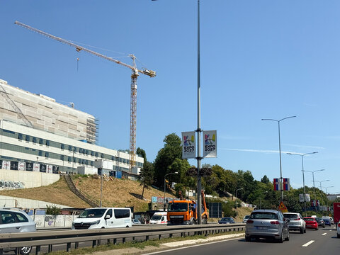 30 July 2026, Belgrade, Serbia: Expo 2027 banners line a busy Belgrade roadway beside cranes and renovation work as Serbia prepares for the international specialized exhibition.