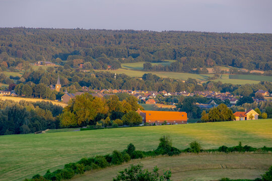 Summer landscape, The terrain hill countryside in Zuid-Limburg, Small houses on hillside in the evening during sunset, Gulpen-Wittem is a villages in Dutch province of Limburg, Gulperberg, Netherlands