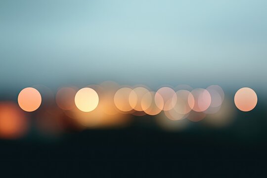 Soft bokeh circles of light create an abstract, dreamy urban twilight vista