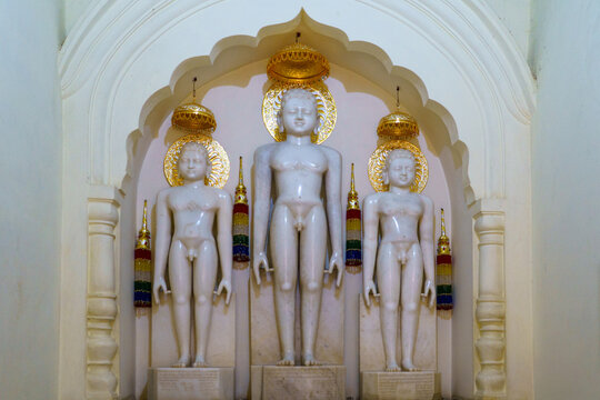 India. Madhya Pradesh. Khajuraho. White marble statues depicting Jain Tirthankaras in a standing meditative posture at the Shantinath Temple