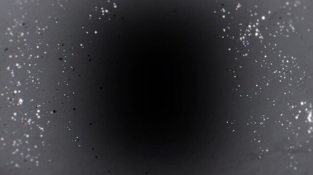 A bright white glowing lightning bolt icon appearing on a dark textured background.