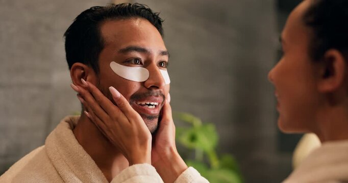 Skincare, couple and eye mask in bathroom, help and laugh with facial treatment for vitamin c. Man, woman and apply patches for dermatology with beauty care, funny and collagen with love at home