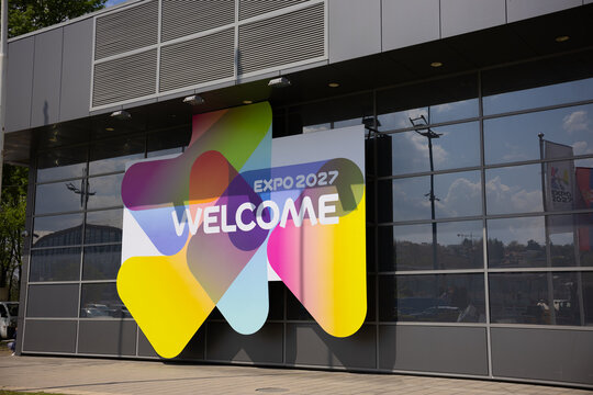 17 April 2026, Belgrade, Serbia: Expo 2027 welcome signage on glass pavilion facade in Belgrade Serbia with colorful gradient branding. International exhibition identity