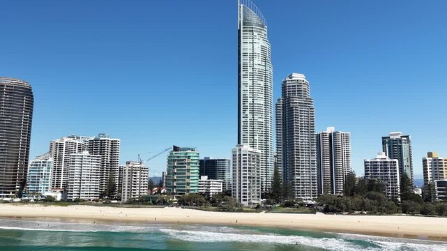 Surfers Paradise aerial drone footage over the beach, surf and high-rise skyline, Gold Coast, Queensland Australia