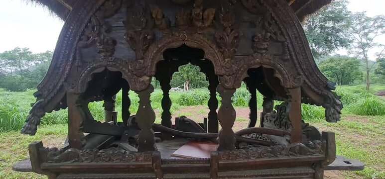 Intricately Carved Traditional Wooden Palanquin Palki Exhibit Displayed Outdoors