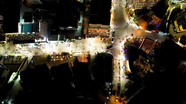 Aerial view of the night life in Ksamil, Bars, restaurants, and hotels with lighting in the dark, Ionian Sea, Saranda, Albania. Drone view from above. Summer destination on the Mediterranean Sea, Euro