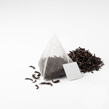 Aromatic pyramid tea bag with loose dry leaves promises calming