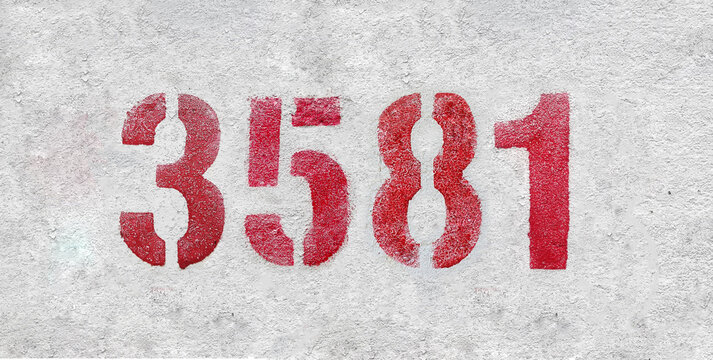red spray-painted number 3581 sprayed onto a white wall.