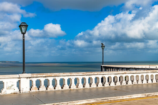 Wall and streetlights by the sea in the historic center of Sao Luis, Maranhao.