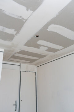 Plasterboard ceiling and walls in a room under renovation