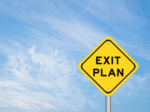 Yellow transportation sign with word exit plan on blue color sky background