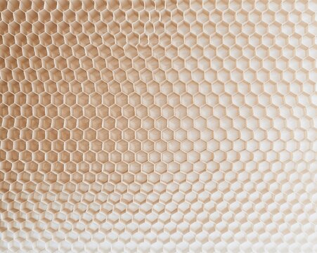 Honeycomb kraft packing wrap with a tactile matte finish and warm brown tones, featuring a repeating cell pattern for packaging mockups and backgrounds