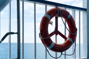 Life buoy on railing overlooking the sea © iBennn