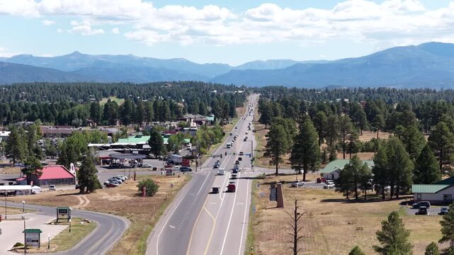 Aerial of commercial strip along US highway 160 in Pagosa Springs Colorado in summer with blue sky