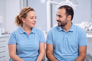 Fototapeta premium Dental team colleagues talking together in modern dentist office