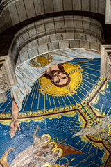 interior religious mural at the sacred-coeur basilica in Paris France with dim soft light on the interior of the cathedral church © STJMEDIA