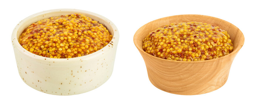 Bowl with french mustard in ceramic and wooden bowl isolated on white background with full depth of field