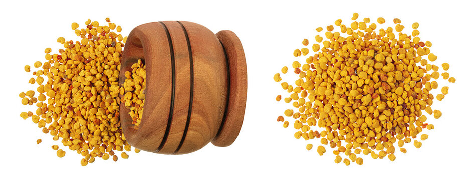 Bee pollen grains in wooden bowl isolated on white background. Top view. Flat lay