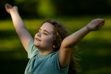Naklejka premium Freedom feels natural in countryside. Freedom supports happy childhood wellness. Outdoor freedom creates joyful mood. Child freedom shows outstretched arms.