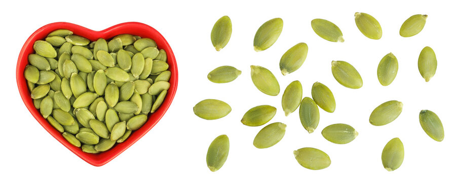 Peeled pumpkin seeds in ceramic bowl isolated on white background. Top view. Flat lay