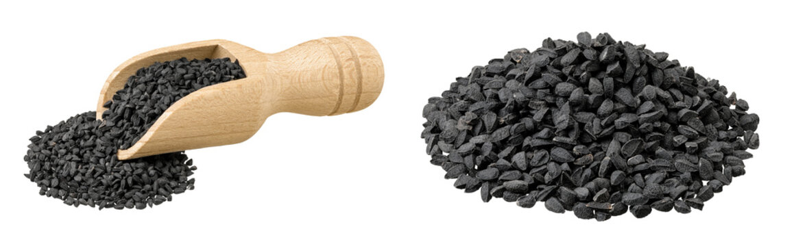 Nigella sativa or Black cumin in wooden scoop isolated on white background