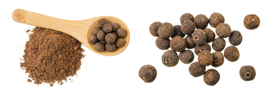 Allspice pepper and ground in wooden spoon isolated on white background. Jamaica pepper, Pimenta dioica or myrtle pepper. Top view