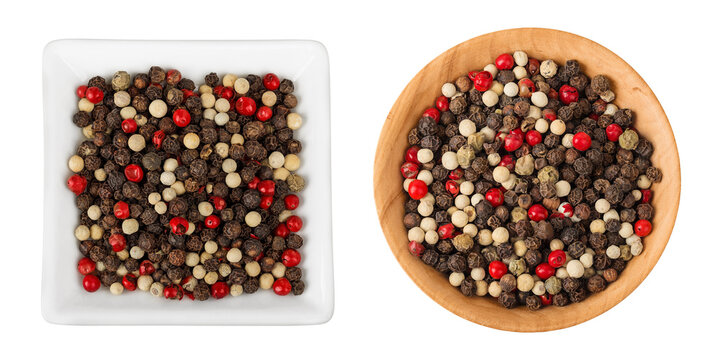 Pepper mix in a ceramic and wooden bowl isolated on white background. Top view