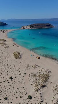 Experience the breathtaking landscapes of Simos Beach, with its golden sands and crystal-clear waters. Enjoy a perfect day under the sun surrounded by natures beauty on Elafonisos Island Greece.