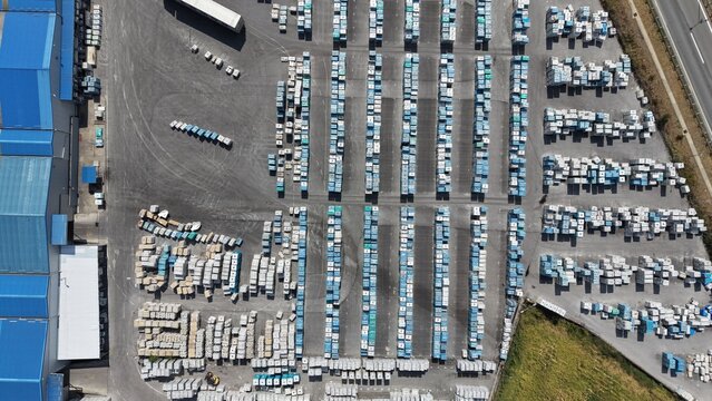 Aerial view of the beer factory facility with rows of stacked crates and pallets in the yard in Kragujevac, Sumadija District, Serbia.