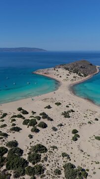 Experience the stunning turquoise waters and soft sandy shores of Simos Beach, a hidden gem on Elafonisos Island Greece. Perfect for relaxation and exploration under the sun.
