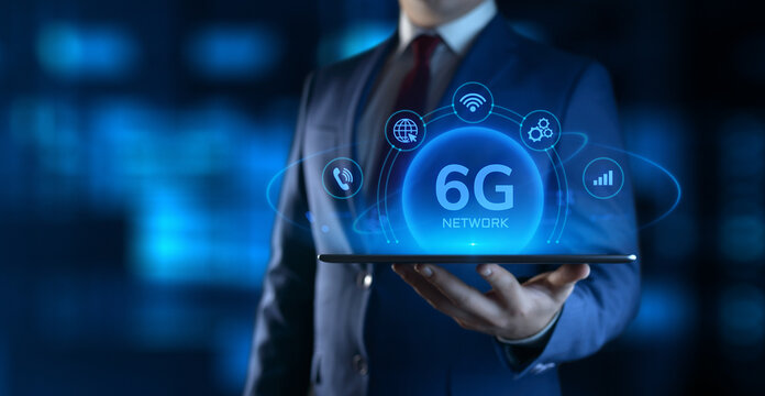 Businessman Holding tablet with 6G Network Icons on Screen. Business and Technology concept