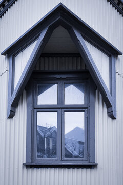 Traditional gabled window detail on corrugated building in Reykjavik Iceland