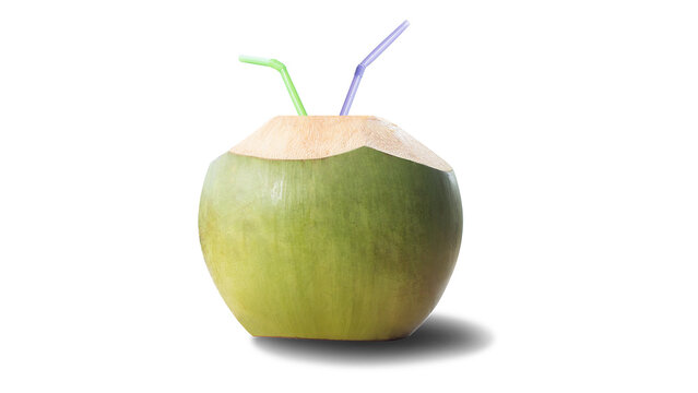 Fresh young green coconut with top cut open and colorful drinking straws inserted isolated on white background, tropical