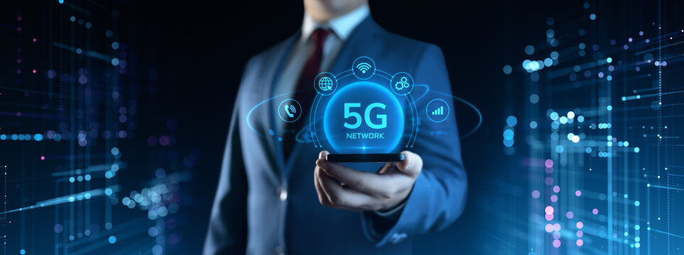 Businessman Holding Smartphone with 5G Network Icons on Screen. Business and Technology concept