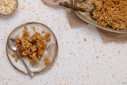 Serving of apple oat crumble dessert on plate