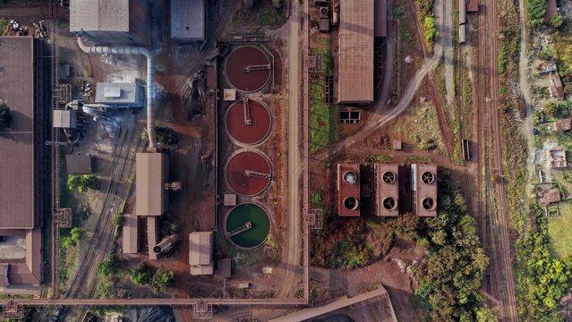 Aerial view of Smederevo Steelworks featuring circular settling tanks, cooling towers, and industrial infrastructure near railway tracks in Smederevo, Podunavlje District, Serbia.